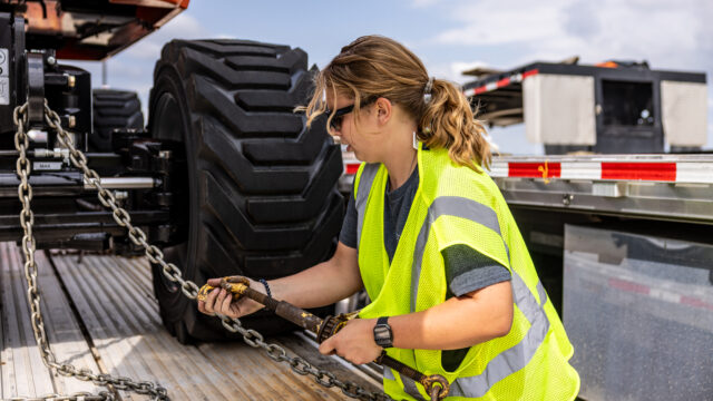 Wylie driver attaching truck trailer.