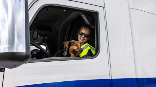 Wylie 2021 OTR Driver of the Year outside of truck. 